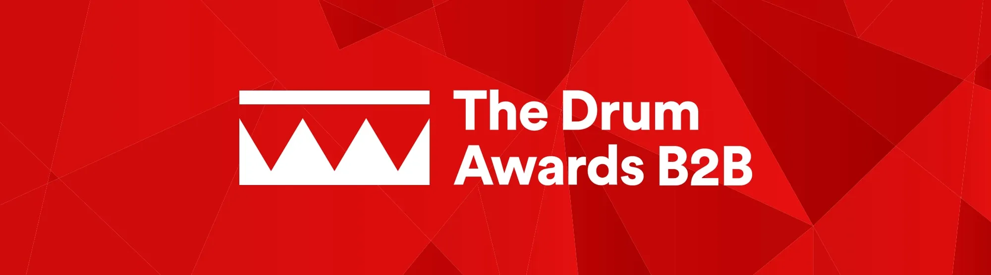 White text reading 'The Drum Awards B2B' with white crown logo of the Drum on a red background