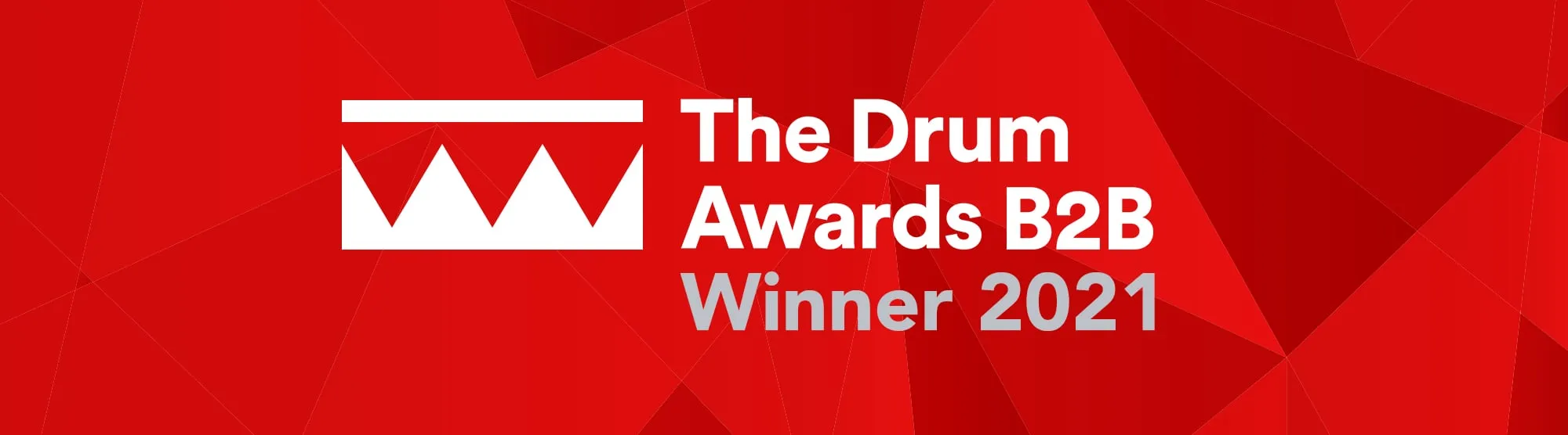 White text reading 'The Drum Awards B2B' and then grey text underneath reading 'Winners 2021' with white crown logo of the Drum on a red background